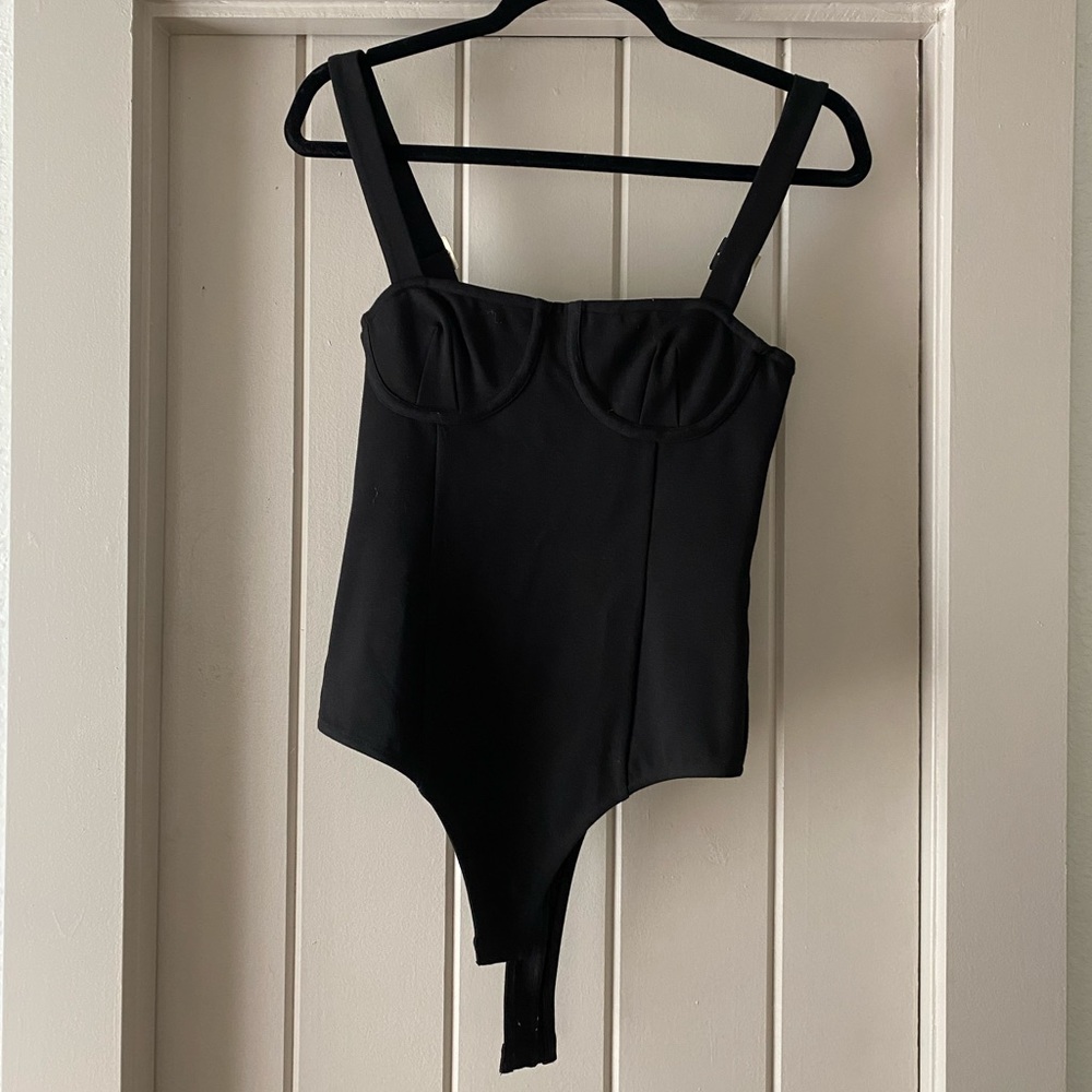 Donna Mizani black bodysuit